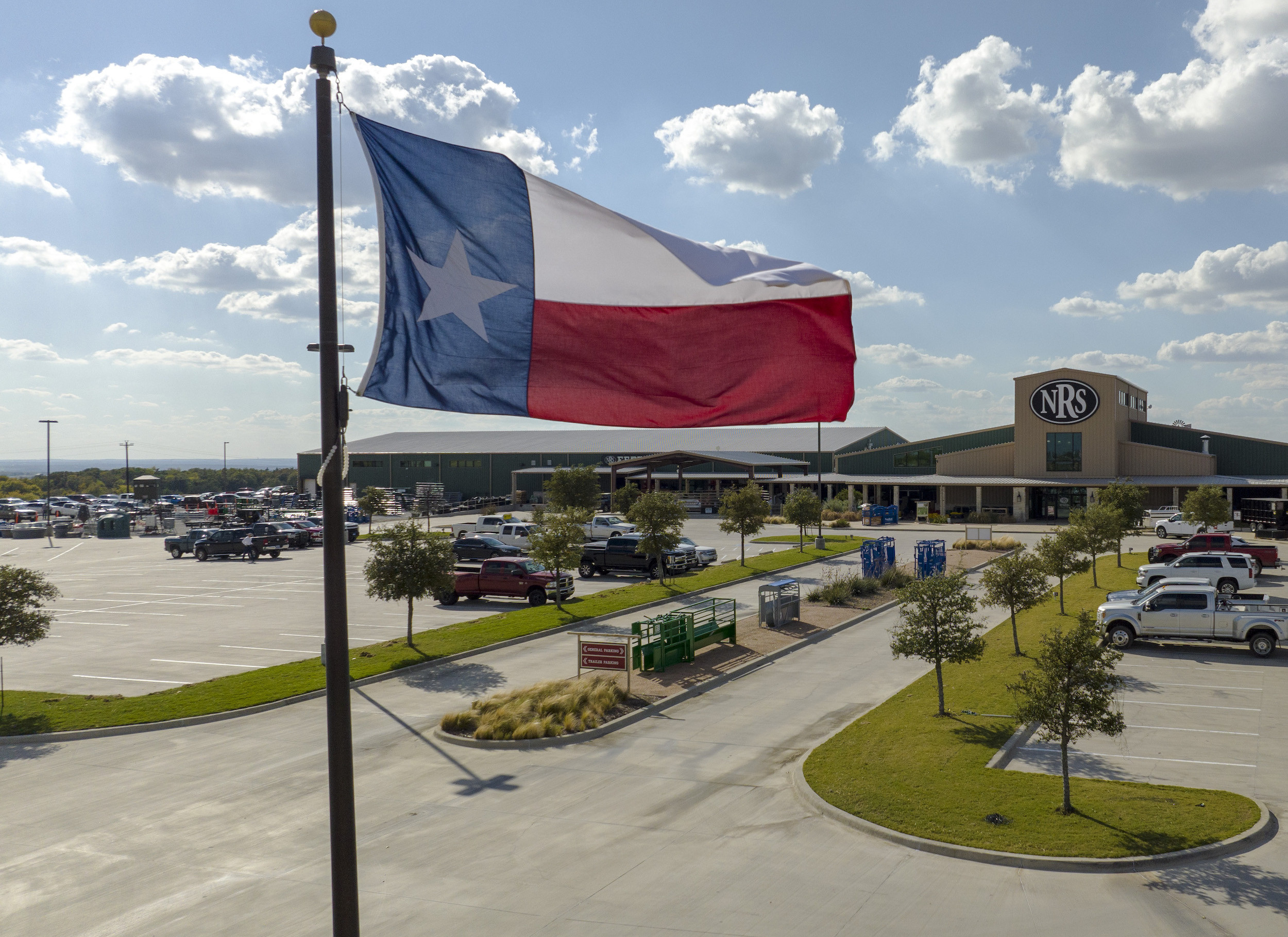 texas flag flying outside of NRS store