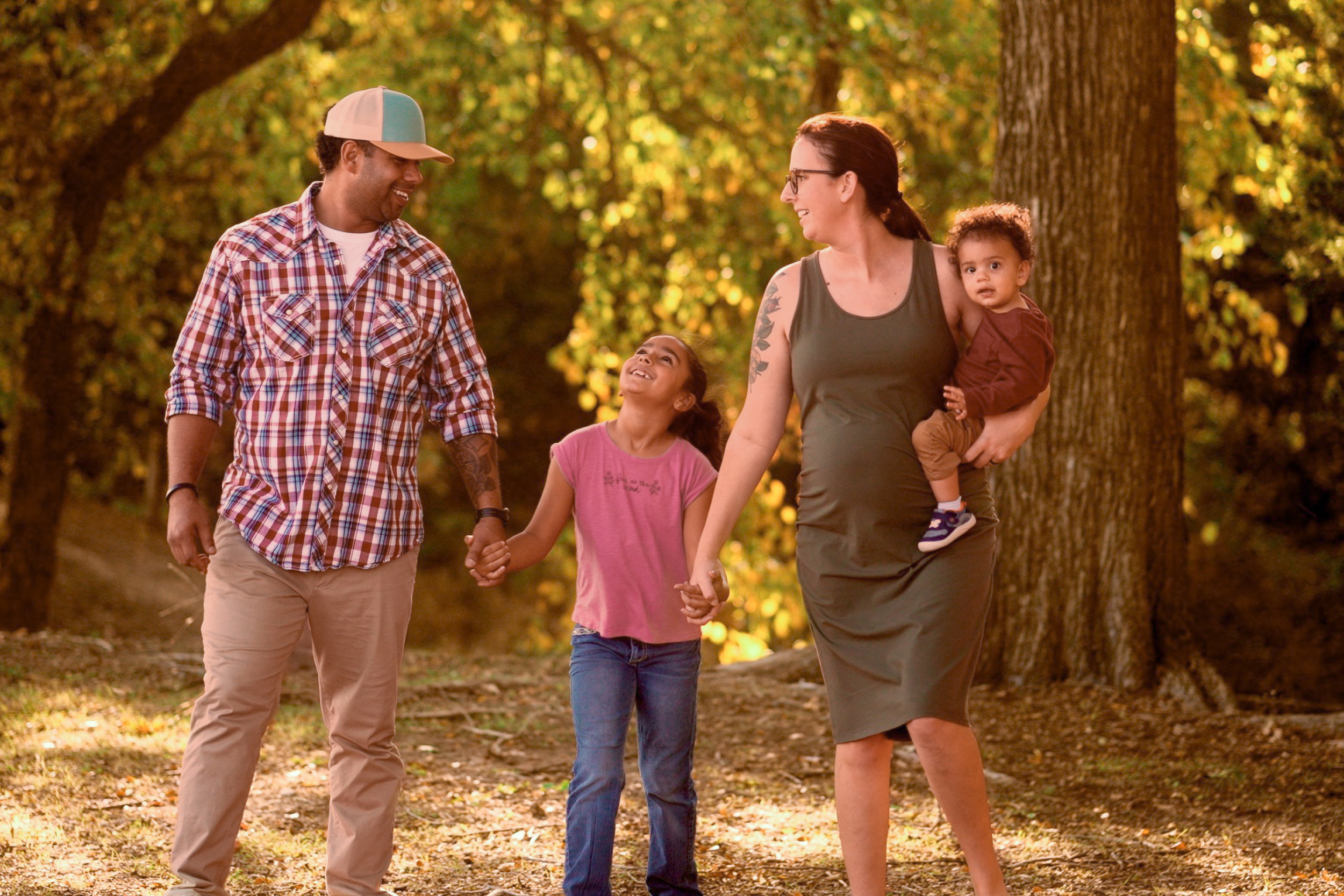 Decatur family standing together in front of nature